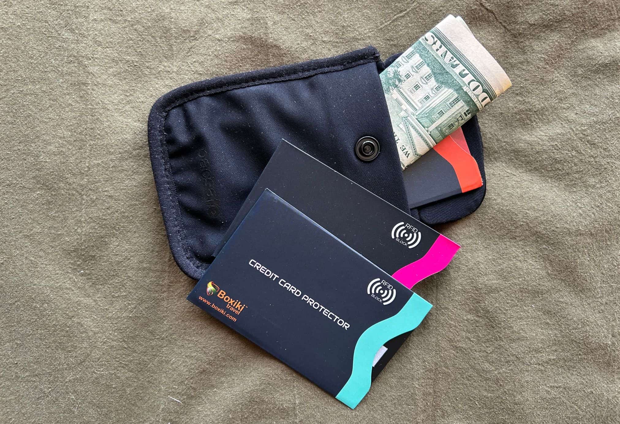 small black pouch with money and credit cards