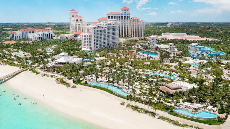 Aerial view of resort with white sand beach and turquoise water