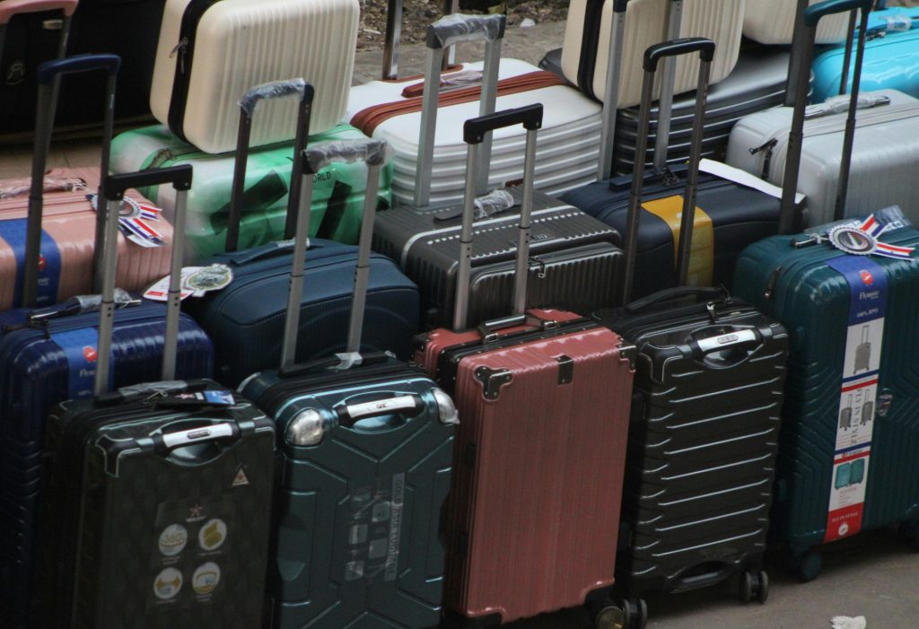 Row of suitcases with handles